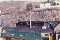 LMS 5025, 37.184 and 26.043 at the north end of Kyle of Lochalsh station on 25 September 1982. The 37 returned the special to Inverness.<br><br>[John Robin 25/09/1982]