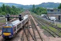 170457 leaves for Glasgow after calling at Perth. The 1962 power signal box and Network Rail HQ are to the right.<br><br>[Brian Forbes 05/06/2008]