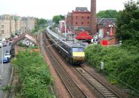 A morning NXEC Kings Cross - Glasgow Central service about to pass under Slateford Road shortly after leaving Haymarket East Junction on 6 June 2008. Wardlaw Terrace is on the left and the Caledonian Brewery to the right. <br><br>[John Furnevel 06/06/2008]