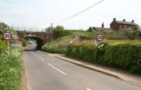 Approaching the hamlet of Ruthwell Station from the south west on 21 May 2008. The former station, on the embankment top right, closed in 1965 and has since been converted into a private residence accessed from the north side of the line.<br><br>[John Furnevel 21/05/2008]