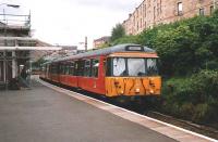 303 061 on a Newton service at Queens Park in July 1997.<br><br>[David Panton /07/1997]