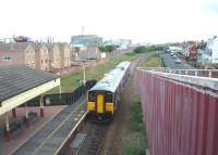 The pleasant looking Pleasure Beach station is ruined by the footbridge that seems to envelop it on both sides. 150207 departs for Blackpool South, just around the corner, on this former double track line now worked as a long siding from Kirkham North Junction. <br><br>[Mark Bartlett 12/06/2008]