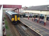 A brand new station opened at Blackpool Pleasure Beach in 1987 but with a traditional style canopy (does anyone know where the components for the canopy came from?). 150207 pulls in on a Colne to Blackpool South service on 12 June. View south towards Squires Gate.<br><br>[Mark Bartlett 12/06/2008]