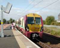 334 022 stands in the sunshine at Rutherglen on 8 September 2007 with a service to Motherwell.<br><br>[David Panton 08/09/2007]