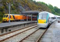 Scene at Waterford on Sunday 18th May 2008, with IE locomotive 214 on the 14.30 to Dublin alongside one of the latest 220 units, very much the <I>new order</I> in this part of the world.<br><br>[Colin Miller 18/05/2008]