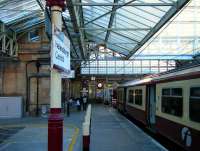 320 312 stands at the buffer stops at Helensburgh Central on 14 June.<br><br>[Veronica Inglis 14/06/2008]