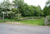 The level crossing at Heriot on the Waverley route, looking south along the platform in the direction of Fountainhall on 8 June 2008. After many years of <I>hanging by a thread</I> the old wooden crossing gates have finally been removed. [See image 14496] <br><br>[John Furnevel 08/06/2008]
