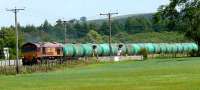 EWS 66111 heads south through the Bow of Fife with train 6D71, empty aviation fuel tanks en route from Linkswood (RAF Leuchars) to Mossend.<br><br>[Brian Forbes 18/06/2008]