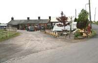 Approach to the former Racks station from the east on 21 May 2008 with the entrance to the station and goods yard on the left and the road bridge over the main line top right.<br><br>[John Furnevel 21/05/2008]