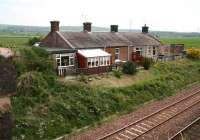 The converted station building at Racks looking east across the lines in May 2008. During its 117 years as a station until closure in 1965 the (still noticeable) difference in height between the main building and platform level was overcome by the use of two fenced diagonal ramps built into the slope with the remainder of the area occupied by a profusion of shrubbery and flower beds.<br><br>[John Furnevel 21/05/2008]