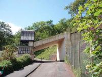 Although the cars perhaps look older the Babbacombe Cliff Railway dates from 1926 and the stations and this fine looking bridge are in Art Deco style. A car climbs past the ticket office at Oddicombe Beach station in June 2008. <br><br>[Mark Bartlett 19/06/2008]