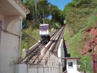 View from Oddicombe Beach up the hill to Babbacombe cliff top as a car descends towards the station. Using the railway avoids a road climb of 1:3. Further information about the line can be found at www.friendsofbabbacombecliffrailway.org.uk <br><br>[Mark Bartlett 19/06/2008]