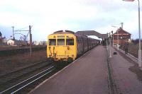 Less than four years after through steam expresses had ceased, an LMS built Liverpool-Southport Class 502 EMU set waits at Ormskirk. The end on arrangement, separated by buffers, to meet Preston trains was already established and a young Malcolm Chattwood stands alongside the disused bay platform prior to catching the Cravens DMU back to Preston. [See image 52871] for the same location in 2015.<br><br>[Mark Bartlett /03/1972]
