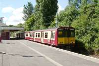 314 209 pulls away from Muirend on 14 June bound for Glasgow Central.<br><br>[David Panton 14/06/2008]