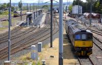 Scene at Craigentinny on 23 June as 66132 passes on the main line with the empty <I>Binliner</I> containers from Oxwelmains returning to Powderhall, while West Coast Railway locomotives 47826 and 33025 stand in the east sidings.<br><br>[Bill Roberton 23/06/2008]