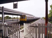 A DMU for Nottingham stands at platform 3 at Skegness in 1994. One of many seaside stations with long abandoned excursion platforms left over from pre package-holiday days.<br><br>[Ian Dinmore //1994]