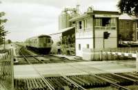 Cravens 105 DMU on an Ormskirk to Preston service calls at Midge Hall in the late 1970s to surrender the token from Rufford. At this time double track was still in place from here to Farington Curve junction but not for much longer. <br><br>[Mark Bartlett //]