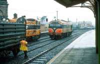 <I>Take yer time why dontcha ...whenever yer ready...no hurry at all, at all....</I> soaked and fed up looking railwayman stands in a downpour at Drogheda in 1993 waiting to couple up a freight.<br><br>[Bill Roberton //1993]