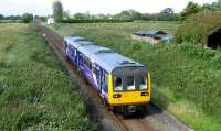 Looking towards Midge Hall on 25 June as 142012 approaches on a Preston - Ormskirk service, having just passed over Pages occupation crossing.<br><br>[John McIntyre 25/06/2008]