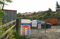 Northside site entrance at Uphall station during engineers occupation of the line on Sunday 29 June. Work in preparation for the new platform, access roads, car parking and other infrastructure is underway. A PW train stands in the station behind EWS 66008 and is straddling the rail bridge over the B8046 just off picture to the right. The road below the bridge is single-file here, controlled by traffic lights, and could become a significant bottleneck given current station expansion plans.  <br><br>[John Furnevel 29/06/2008]