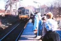 <I>Be afraid...be very afraid...</I> The ladies of Garston, on the St Albans Abbey Branch, prepare themselves for the arrival of their British Rail <I>Christmas Shoppers Special</I> on a bright December morning in the late 1960s. The train is formed by a Derby lightweight DMU, the last example of which was withdrawn in 1969.<br><br>[Ian Dinmore //]