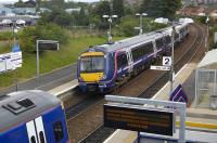 A pair of Fife Circle services formed by 170 453 and 158 739 crossing at Dunfermline Queen Margaret on 30 June.<br><br>[Bill Roberton 30/06/2008]