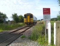 Single unit 153359 on a Preston to Ormskirk working is seen at the amusingly named Sod Hall occupation crossing looking towards Midge Hall on 24 June 2008.<br><br>[John McIntyre 24/06/2008]