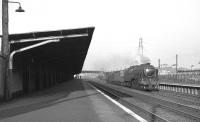 Royal Scot Class 4-6-0 46116 <I>Irish Guardsman</I> rushes through Hillington West  on the down fast line in May 1963 with a lightweight fitted freight .<br><br>[Colin Miller 21/05/1963]