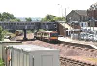 Edinburgh and Dunblane services pass at Larbert station on 3 July 2008.<br><br>[John Furnevel 03/07/2008]