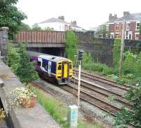 158758 on a Blackpool to York service passes under Wellfield Road bridge at the junction with the WCML to the north of Preston station. <br><br>[Mark Bartlett 29/06/2008]