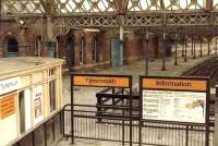 View towards Newcastle over the disused bays at the 1882 NER station at Tynemouth in July 1981 with signage relating to Tyne and Wear PTE Metro services in the foreground.<br><br>[Colin Alexander 25/07/1981]