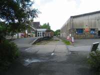 Looking north over the former level crossing at Torrington station, Devon, on 3 July 2008. The old station building is now the <I>Puffing Billy</I> public house and the area under the platform canopy has been enclosed.<br><br>[John McIntyre 03/07/2008]