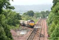 A PW train about to come off the Bathgate branch and onto the Edinburgh - Glasgow main line at Newbridge Junction on a wet 29 June behind EWS 66184. [See image 21576]<br><br>[John Furnevel 29/06/2008]