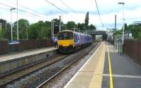 Looking north towards the road bridge at Euxton Balshaw Lane station on 14 June as the guard checks the passengers off a service from Liverpool heading for Blackpool North.<br><br>[John McIntyre 14/06/2008]