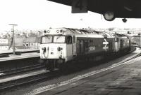 A pair of class 50s, with 50049 <I>Defiance</I> nearest the camera, standing on the middle road at Plymouth circa 1986 waiting to take over an incoming train for Paddington.<br><br>[Colin Alexander //1986]