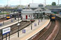 An Alloa - Glasgow Queen Street train (left) and another on the Dunblane - Edinburgh Waverley route stand at Stirling station on 12 June 2008. Part of the new footbridge can be seen crossing the station in the background.  <br><br>[John Furnevel 12/06/2008]