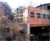 Close up of the front of the abandoned Fowler DM shunter at R M Supplies, Inverkeithing on 28 March 2008, with the lettering <I>John Williams (Wishaw) Ltd</I> still visible on the rust. [Railscot note: The John Williams Excelsior Works was a medium sized malleable iron works, started in 1866 and specialising in iron sheets, rolled in sheet mills. In 1879 it installed the first three open hearth furnaces in Motherwell for the manufacture of steel. However, its experiments were not successful and other firms went on to capture the steel market. Williams went on to manufacture wire, nails, staples, rivets and washers.]<br>
<br><br>[Grant Robertson 28/03/2008]