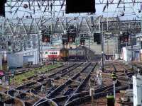 A pair of Class 156s take the long way round at Bridge Street Junction on 30th June with a service for Paisley Canal.<br><br>[Graham Morgan 30/06/2008]