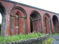 Whalley viaduct is close to historic Whalley Abbey and these two ornately infilled arches stand either side of the road to the abbey gatehouse. <br><br>[Mark Bartlett 17/07/2008]