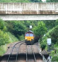 EWS 66018 is held at signals on the curve shortly after leaving Gretna Junction with a northbound freight on 17 July. The hold-up is due to a southbound passenger train occupying the single line section between Annan and Gretna Green. <br><br>[John Furnevel 17/07/2008]