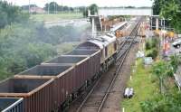 EWS 66018 finally gets the road north at Gretna Green on 17 July 2008, following the crossing of a Glasgow Central - Carlisle service, and accelerates towards the station and onto the single line section to Annan.  <br><br>[John Furnevel 17/07/2008]