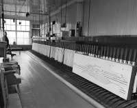 Interior of Bathgate Central Signalbox circa 1981, shortly before closure and demolition.  At this time only two levers were in use for signals.  The old track diagram leans against the frame.<br><br>[Bill Roberton //1981]
