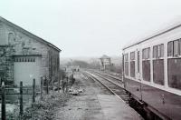 View towards Skelmanthorpe past the old goods shed as a Derby 108 dmu waits to leave Clayton West for Huddersfield with a BRCW 110 making up a 5 car train. The infrastructure reflects that the local coal mine was also still receiving trains at this time. <br><br>[Mark Bartlett 17/01/1981]