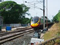 Recent Down line tracklaying at Bay Horse has resulted in the removal of the emergency crossovers there. Contractors are still in the former goods yard, which also contains a 25kv feeder station, hence the intricate catenary. Although on this date there was still a temporary speed restriction on the Down line the Pendolino is on the Up and heading for Euston at full speed. <br><br>[Mark Bartlett 21/07/2008]