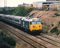 50016 <I>Barham</I> passes the site of Carn Brea station (closed 1961), on the Great Western main line between Camborne and�Redruth, with an up service�circa 1986.<br>
<br><br>[Colin Alexander //1986]