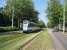 Track maintenance equipment in the Amsterdam suburbs must consist of a lawnmower! An Amsterdam tram heads towards the centre of town an a grassy reserved trackbed.<br><br>[Michael Gibb 21/05/2008]