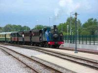 CFBS Haine-St Pierre 2-6-0T No 15 of 1920 arrives at Noyelles on 20 August 2006 with a morning train from Le Crotoy.  To proceed to St Valery-sur-Somme the engine must run round the train.  The SNCF station on the former Paris-Calais main line lies behind.<br><br>[Mark Poustie 20/08/2006]