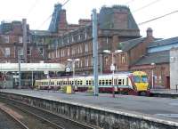 Looking across the platforms at Ayr station in July 2002. The station Hotel dominates the background.<br><br>[John Furnevel 12/07/2002]