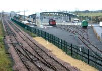 The main exhibition hall at the National Railway Museum at Shildon, built on the site of a former yard. View is east on 2 November 2004, with the Bishop Auckland - Darlington line running past on the left.<br><br>[John Furnevel 02/11/2004]