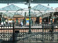 The old sliding metal gate allowing passengers to enter platform 1 at Tynemouth station, photographed in July 2004. <br><br>[John Furnevel 10/07/2004]